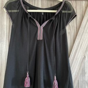 Beautiful casual blouse with sheer sleeves and tassles.